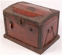 Lot 243 - A Chinese red painted and beaded wooden trunk,...