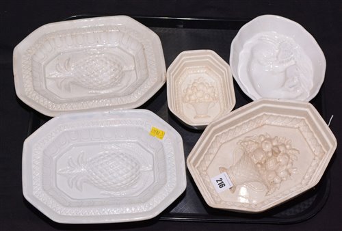 Lot 216 - Five assorted 19th Century creamware and other blancmange dishes
