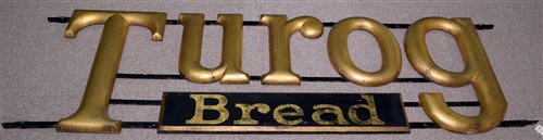 Lot 194 - Turog bread advertising sign wood mounted on...