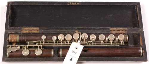 Lot 4 - A.H. Langois rosewood flute with German silver...