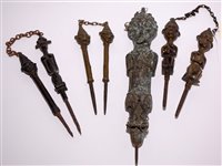 Lot 282 - Yoruba bronze ritual fertility staffs.