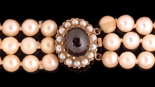 Lot 763 - Three strand pearl necklace