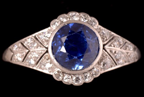Lot 705 - Sapphire and diamond ring.