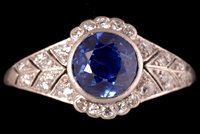 Lot 705 - Sapphire and diamond ring.