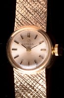 Lot 673 - A lady's 9ct. gold cocktail watch.