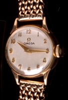 Lot 674 - A lady's 9ct. bracelet watch.