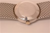 Lot 680 - A lady's 18ct. white gold bracelet watch.
