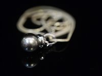 Lot 850 - A Tahitian black pearl and diamond pendant