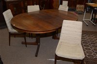Lot 765 - A rosewood dining table and four chairs circa 1960's