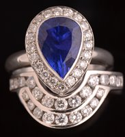 Lot 756 - Tanzanite and diamond ring and eternity ring
