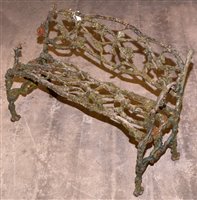 Lot 1008 - A Coalbrookdale style garden seat.