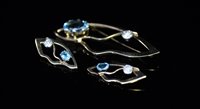Lot 707 - Topaz and zircon brooch and earring set