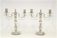 Lot 565 - A pair of silver candelabra