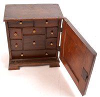 Lot 1021 - An oak table top spice cabinet.