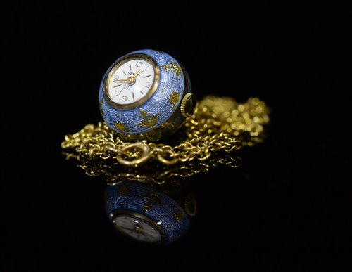 Lot 703 - Blue guilloche watch pendant