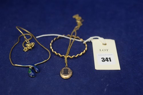 Lot 341 - Yellow metal bangle, locket, necklace