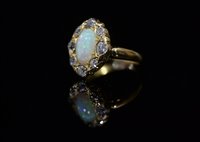 Lot 761 - Opal and diamond cluster ring.