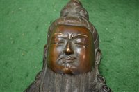 Lot 36 - A Chinese bronze figure of a seated bearded...
