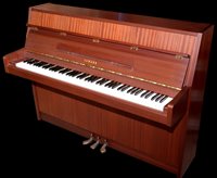 Lot 944 - An upright overstrung piano.