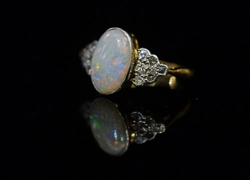 Lot 717 - Opal and diamond ring