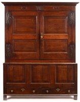 Lot 962 - A Georgian oak press cupboard.