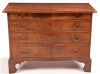 Lot 964 - A George III mahogany serpentine fronted chest.