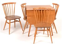 Lot 1074 - Ercol drop leaf dining table and chairs