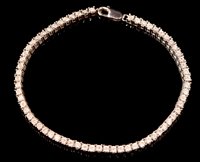 Lot 800 - Diamond and silver bracelet.