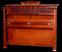 Lot 884 - An Arts & Crafts upright overstrung piano.