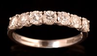 Lot 814 - Diamond half hoop eternity ring