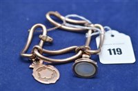 Lot 119 - A metal bracelet; a gold badge; and a fob seal.