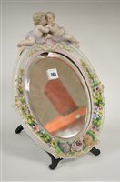Lot 175 - Dresden porcelain oval mirror