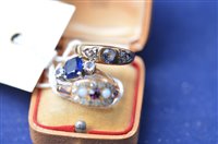 Lot 932 - An opal style stone and white stone ring