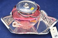 Lot 879 - A silver pierced rectangular basket by Edward Viners Sheffield 1944 and a cranberry glass and plated metal mounted jar.