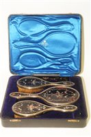 Lot 579 - A silver and inlaid tortoise shell dressing table set