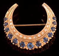 Lot 788 - Sapphire and diamond crescent brooch