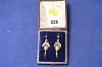 Lot 926 - A pair of Victorian hollow cast gold earrings