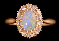 Lot 744 - Opal and diamond cluster ring