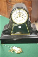 Lot 1242 - French black slate mantel clock.