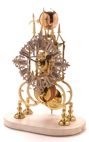 Lot 937 - A Victorian brass skeleton timepiece.