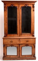 Lot 985 - A mid 19th Century carved rosewood secretaire bookcase.