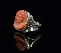 Lot 738 - A carved coral ring