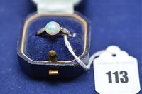 Lot 113 - An opal and diamond ring.