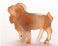Lot 28 - An early 20th Century Chinese carved agate group of a goat and kid.