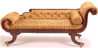 Lot 1004 - A Regency style mahogany scroll-end sofa.