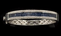 Lot 787 - A sapphire and diamond bangle