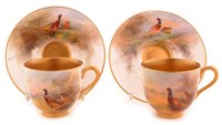 Lot 146 - A pair of Royal Worcester coffee cups and saucers