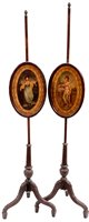 Lot 1029 - A pair of mahogany pole screens.