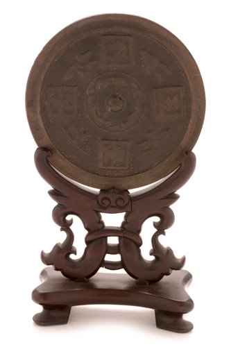 Lot 24 - Chinese bronze mirror disc