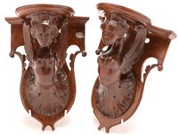 Lot 448 - A pair of carved walnut wall brackets